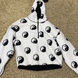 Fluffy sweater and is a cropped sweater